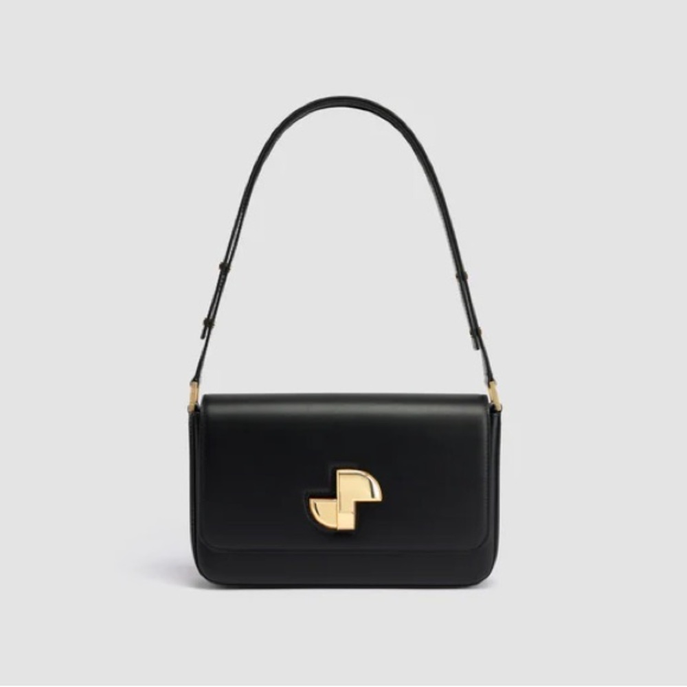Patou Le Lock Shoulder Bag is a black calf leather